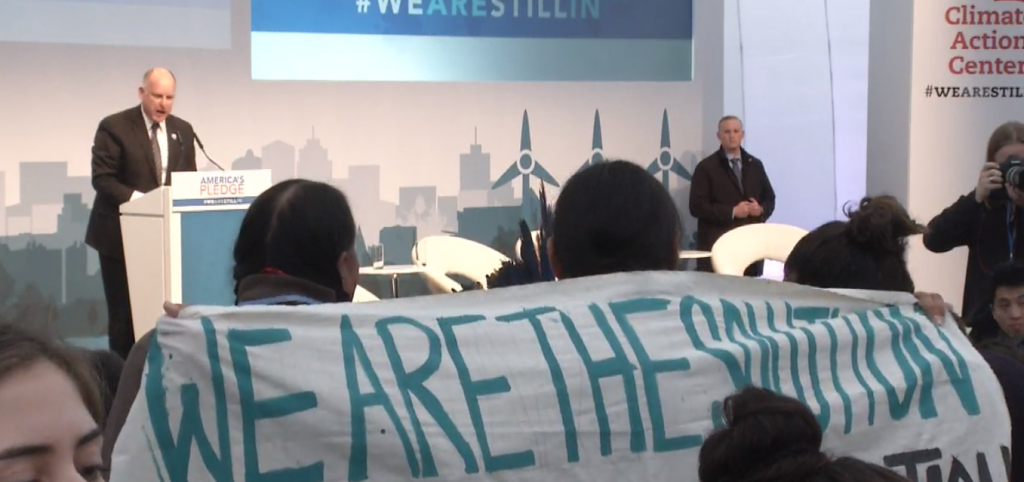 California Governor Jerry Brown tells protesters, "We need action, not noise."